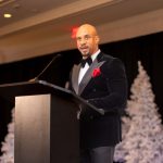 Jeremy Anderson, Man of the Year award recipient, speaking at the STEMii Awards after returning from a student outreach trip in South Africa, captured by Omni Worldwide event photography.